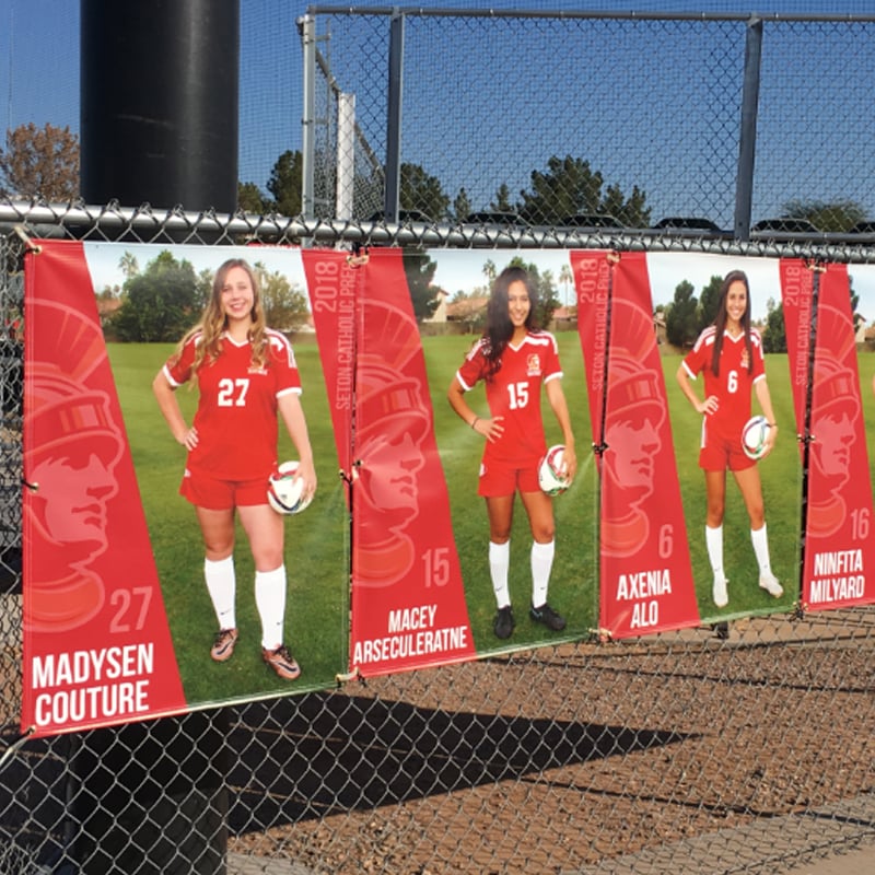 Senior Banners hanging on fence.